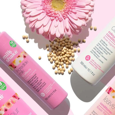 Milkshake hair products: vegan incredible milk leave-in treatment, flower fragrance, pink bottles. Hair care.