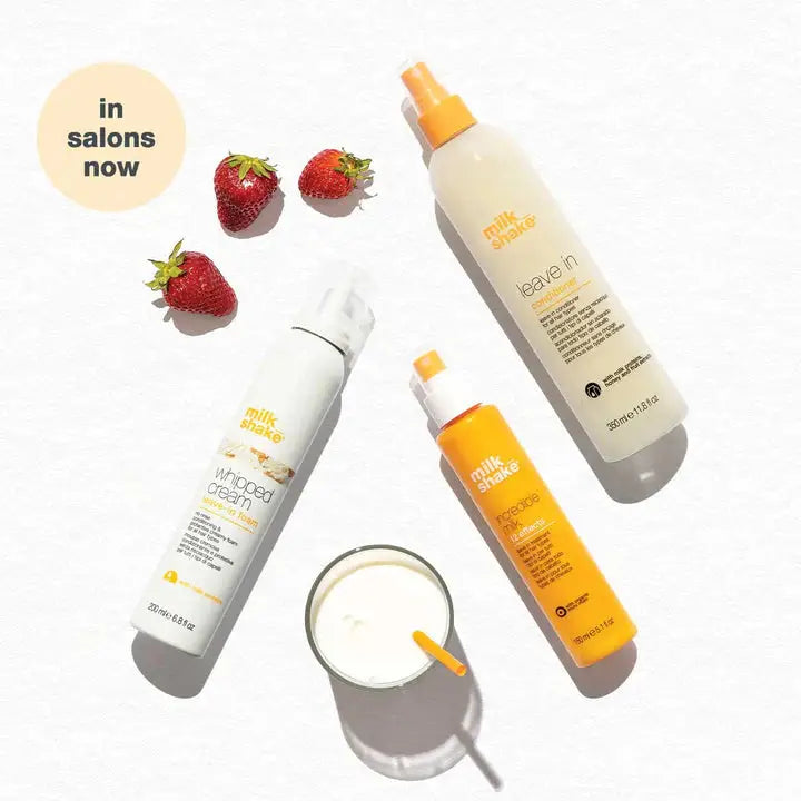 Hair care products and strawberries next to Milkshake Colour Maintainer Sulfate Free Shampoo