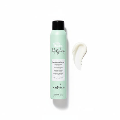 Milkshake heat protection spray for hair in mint green bottle with product cream swatch