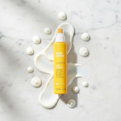 Milkshake treatment bottle on marble surface with cream swirls Milk Shake Incredible Milk 12 Effects