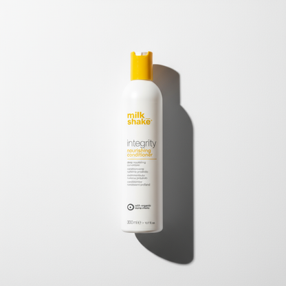 Milkshake integrity conditioner nourishing formula in white bottle with yellow cap 300ml