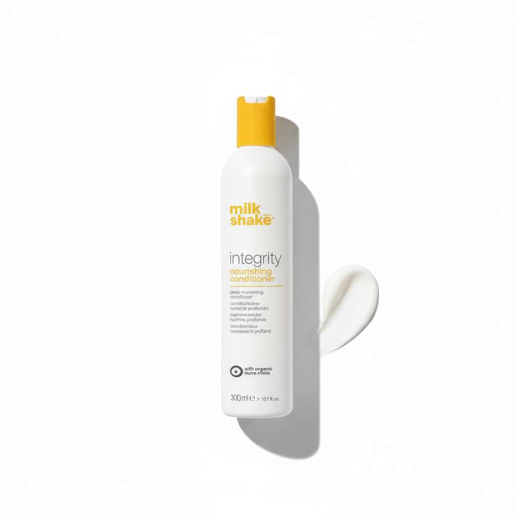 Milkshake integrity conditioner nourishing hair conditioner bottle with white creamy texture on white background