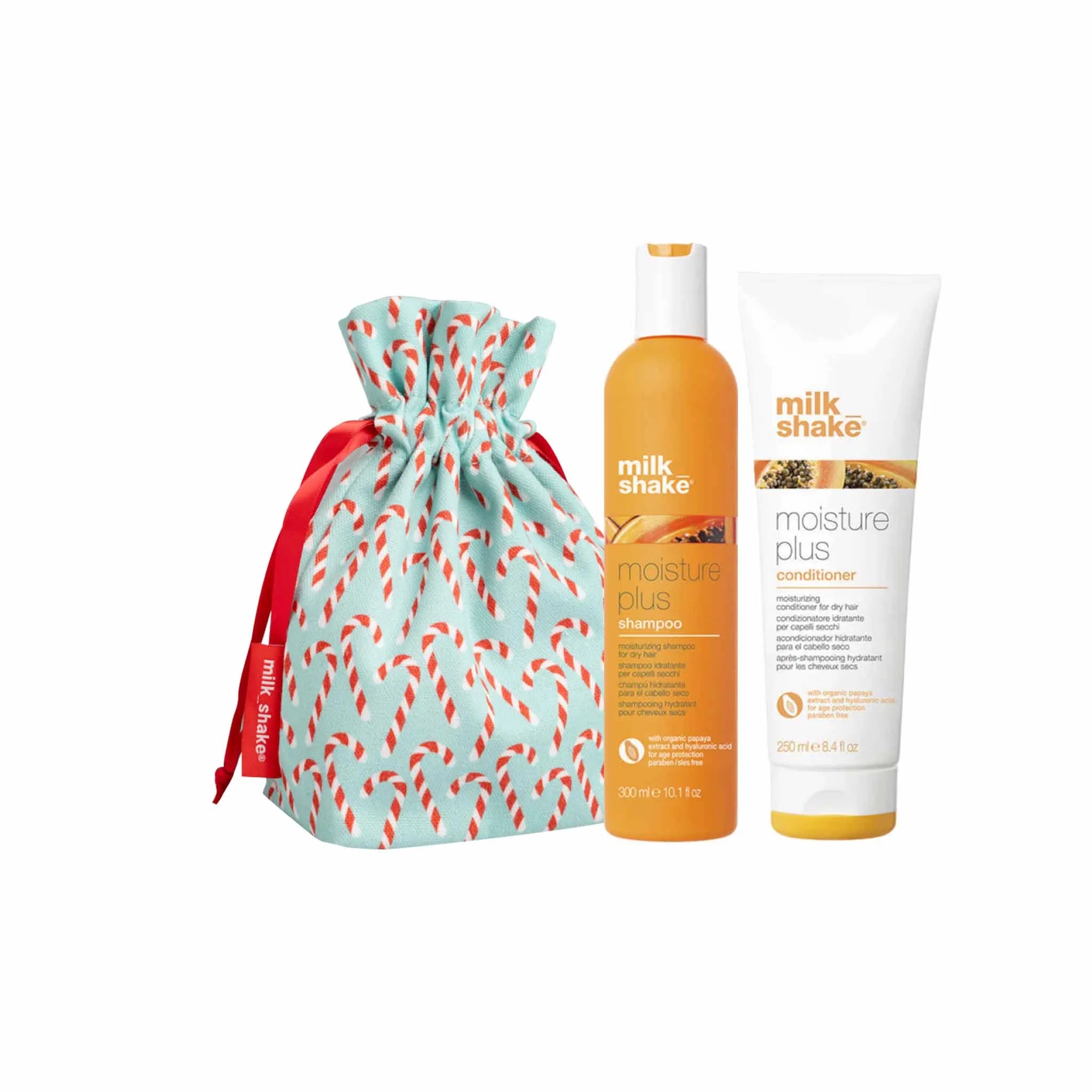 Gift set containing hair care products and a decorative drawstring bag.