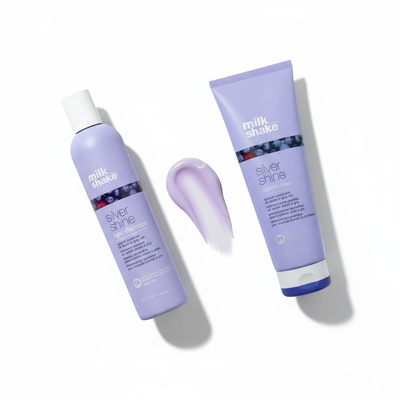 Milkshake Silver Shine Light Duo gift set with purple shampoo and conditioner bottles on white background
