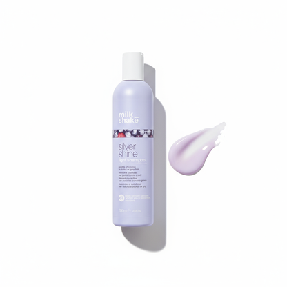 Milkshake Silver Shine light Shampoo bottle with purple cream smear on white background