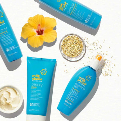 Beauty Mask 200ml with turquoise packaging and yellow hibiscus logo from Milkshake Sun