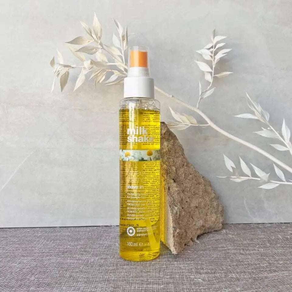 Clear bottle of Sweet Camomile Leave-In 150ml with white spray nozzle and organic extract