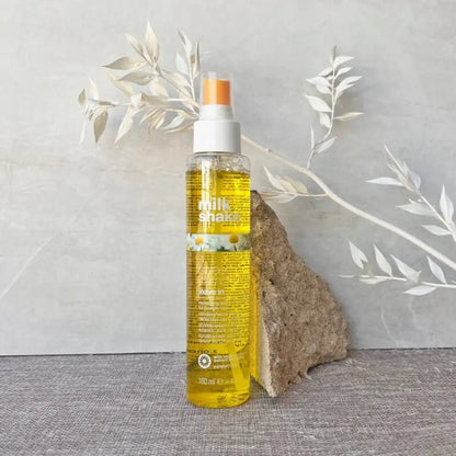 Milkshake Sweet Camomile Leave-in Conditioner in transparent spray bottle with yellow liquid
