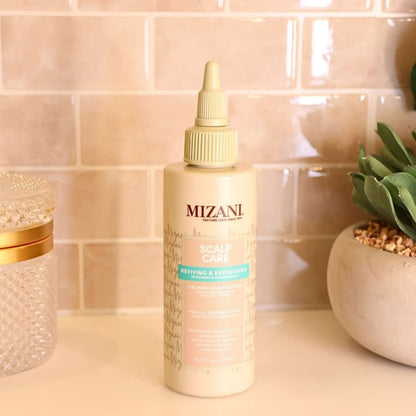 Bottle of Mizani Scalp Care Calming Lotion 118ml labeled ’Reviving & Refreshing’ for scalp care