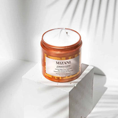 Orange jar of Mizani Strength Fusion Intense Night Time Treatment 150ml