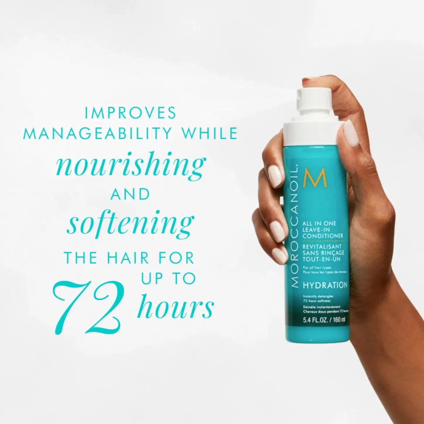 Hand holding Moroccanoil All In One Leave In Conditioner for unruly hair and damaging effects