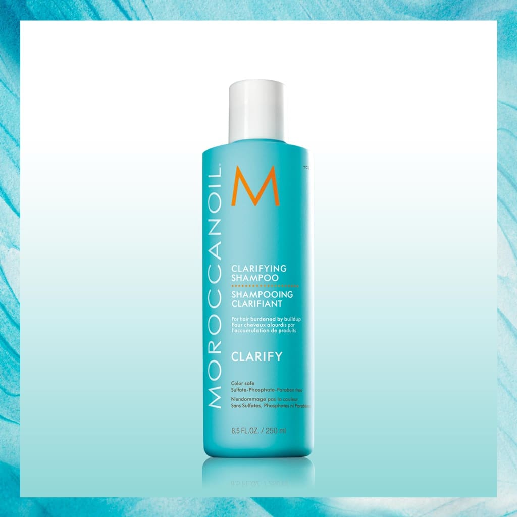 Turquoise bottle of Moroccanoil Clarifying Shampoo 250ml removes everyday buildup