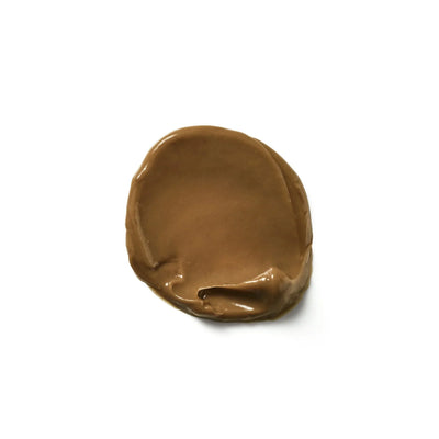 Smooth dollop of chocolate spread next to Moroccanoil Color Deposit Mask Champagne 200ml