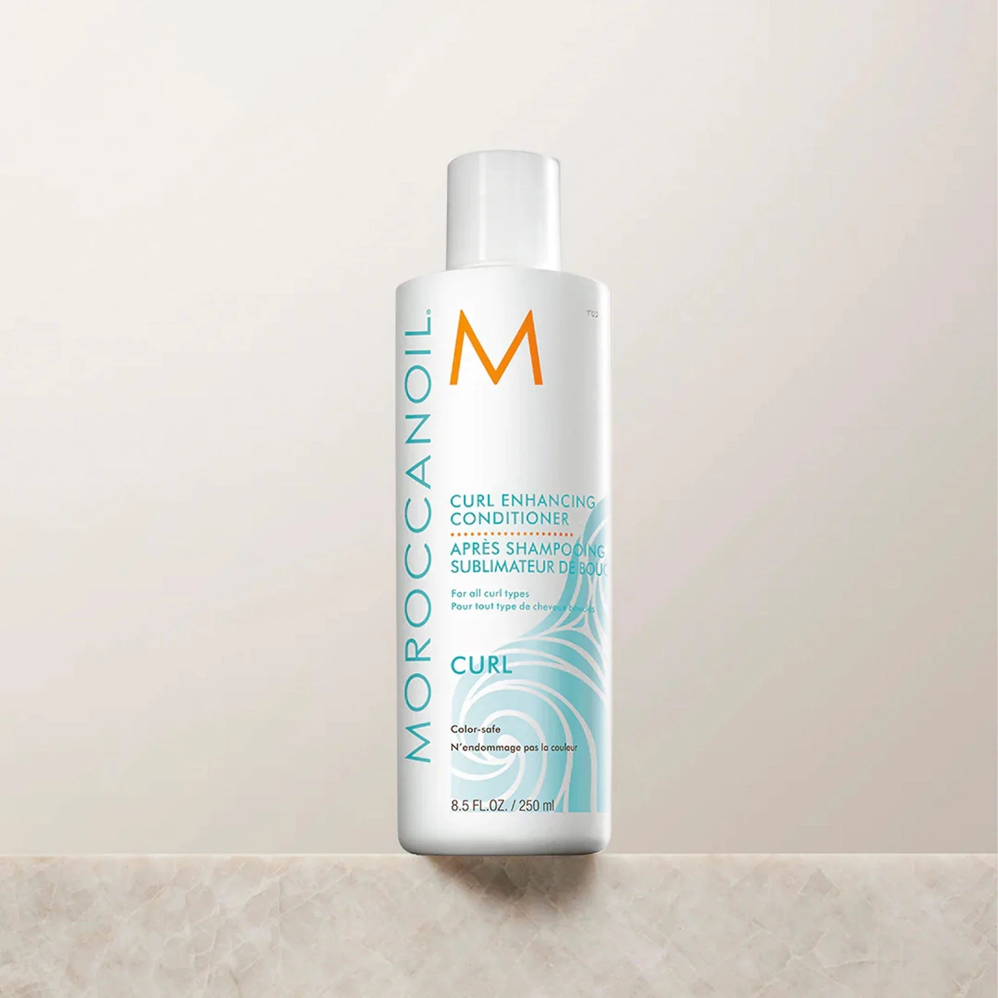 White bottle of Moroccanoil Curl Enhancing Shampoo for frizz-free curls