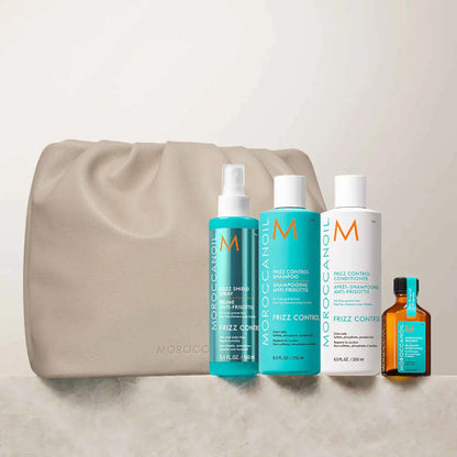 Collection of Moroccanoil hair care products and a beige cosmetic bag.