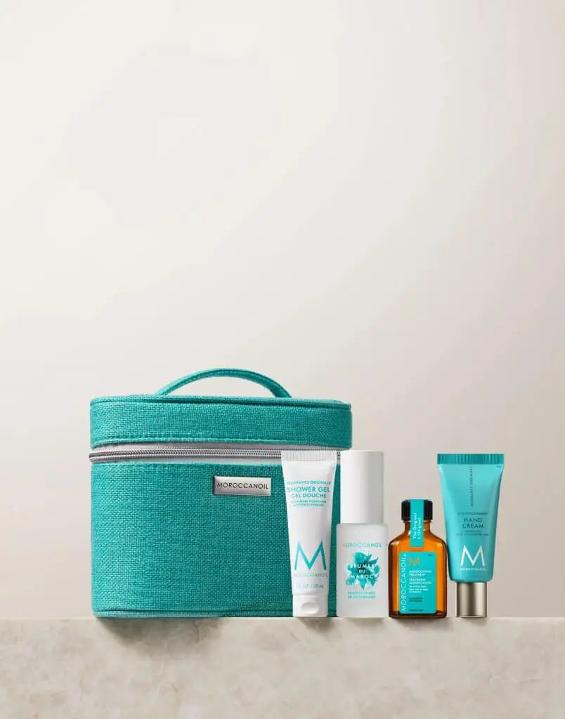 Teal cosmetic bag with Moroccanoil body care travel set, includes free 30ml shower gel