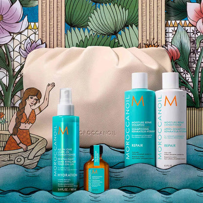 Collection of Moroccanoil hair care products displayed with a beige cosmetic bag.