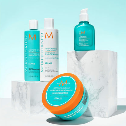 Moroccanoil Restorative Mask 250ml displayed with complementary hair care products on a stylish backdrop.