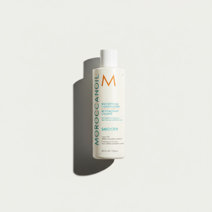 Moroccanoil smoothing conditioner bottle with white packaging and blue text on a white background