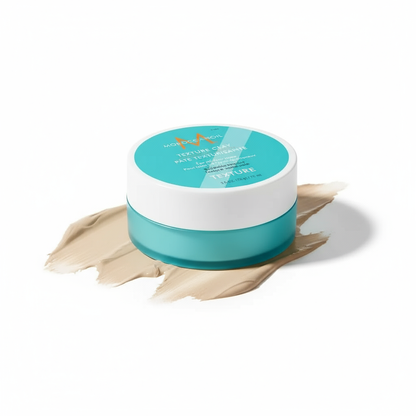 Moroccanoil Texture Clay styling aid in teal jar on beige clay smear for hair texture and hold