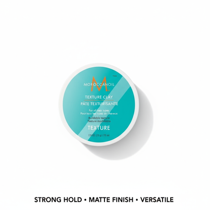 Moroccanoil Texture Clay styling aid in turquoise container with strong hold and matte finish