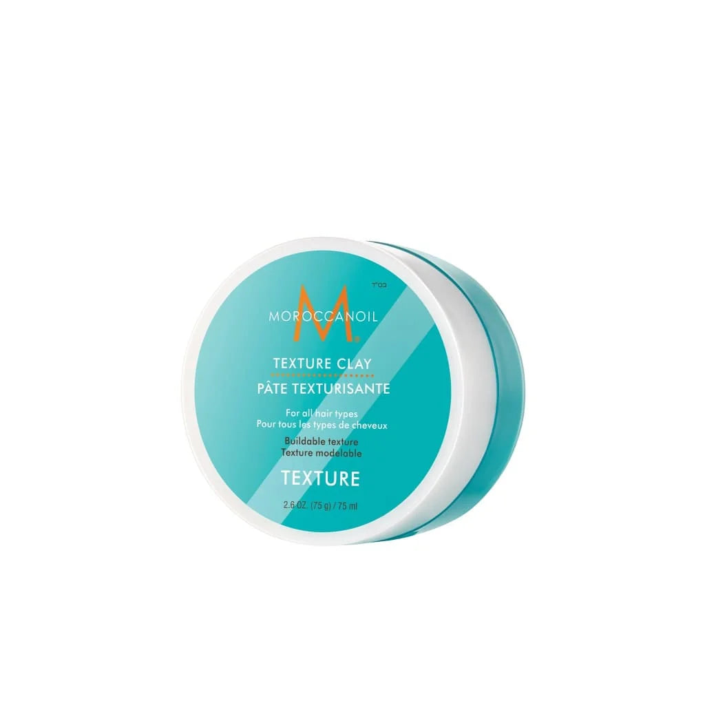 Moroccanoil Texture Clay styling aid in turquoise container for buildable texture and hair styling