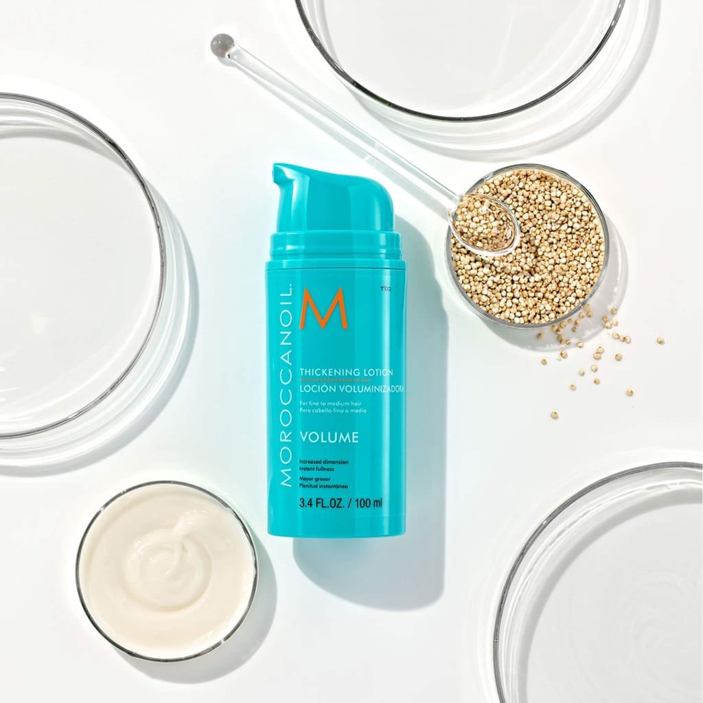 Turquoise bottle of Moroccanoil Thickening Lotion 100ml for instant fullness and hair volume