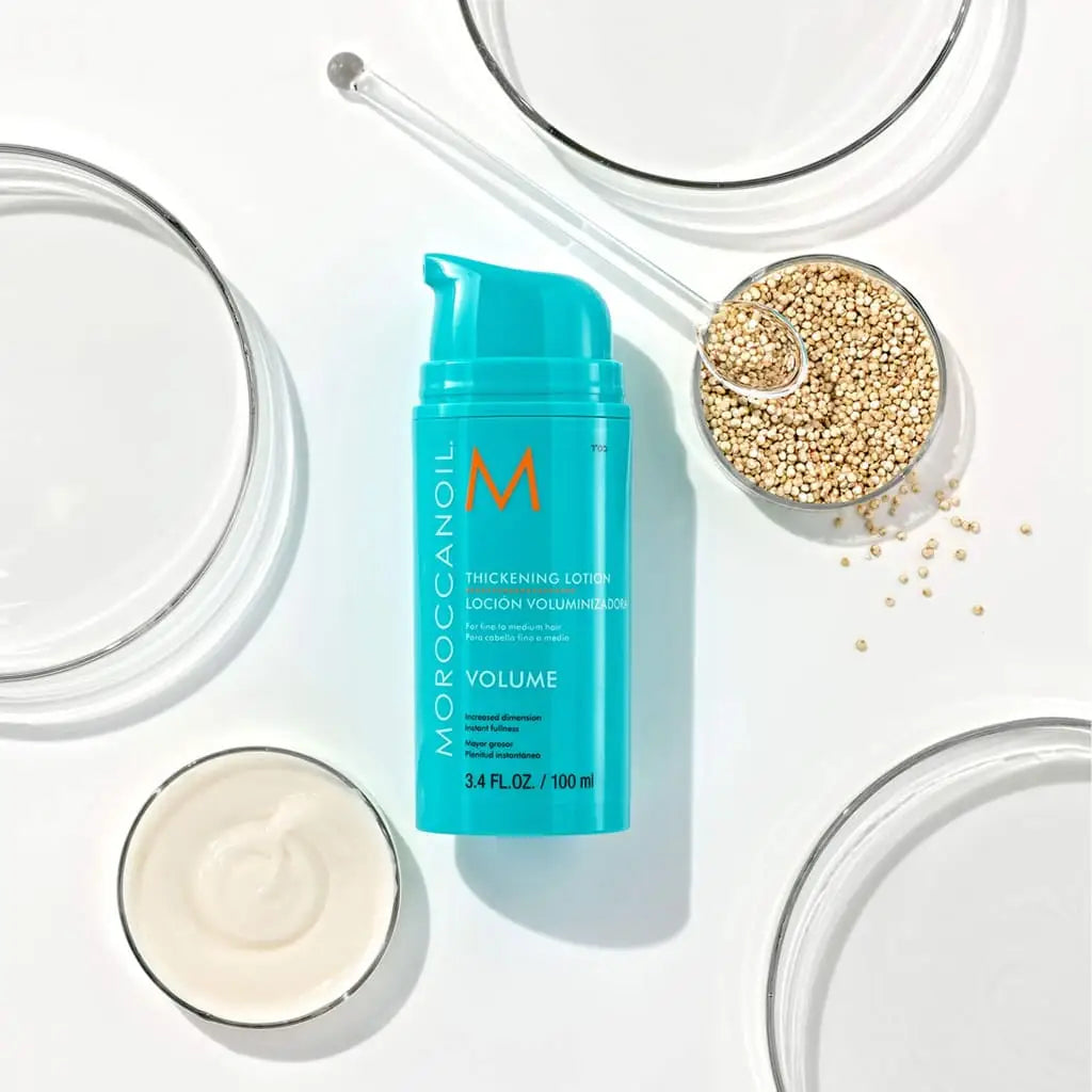 Turquoise bottle of Moroccanoil Thickening Lotion 100ml for instant fullness and hair volume