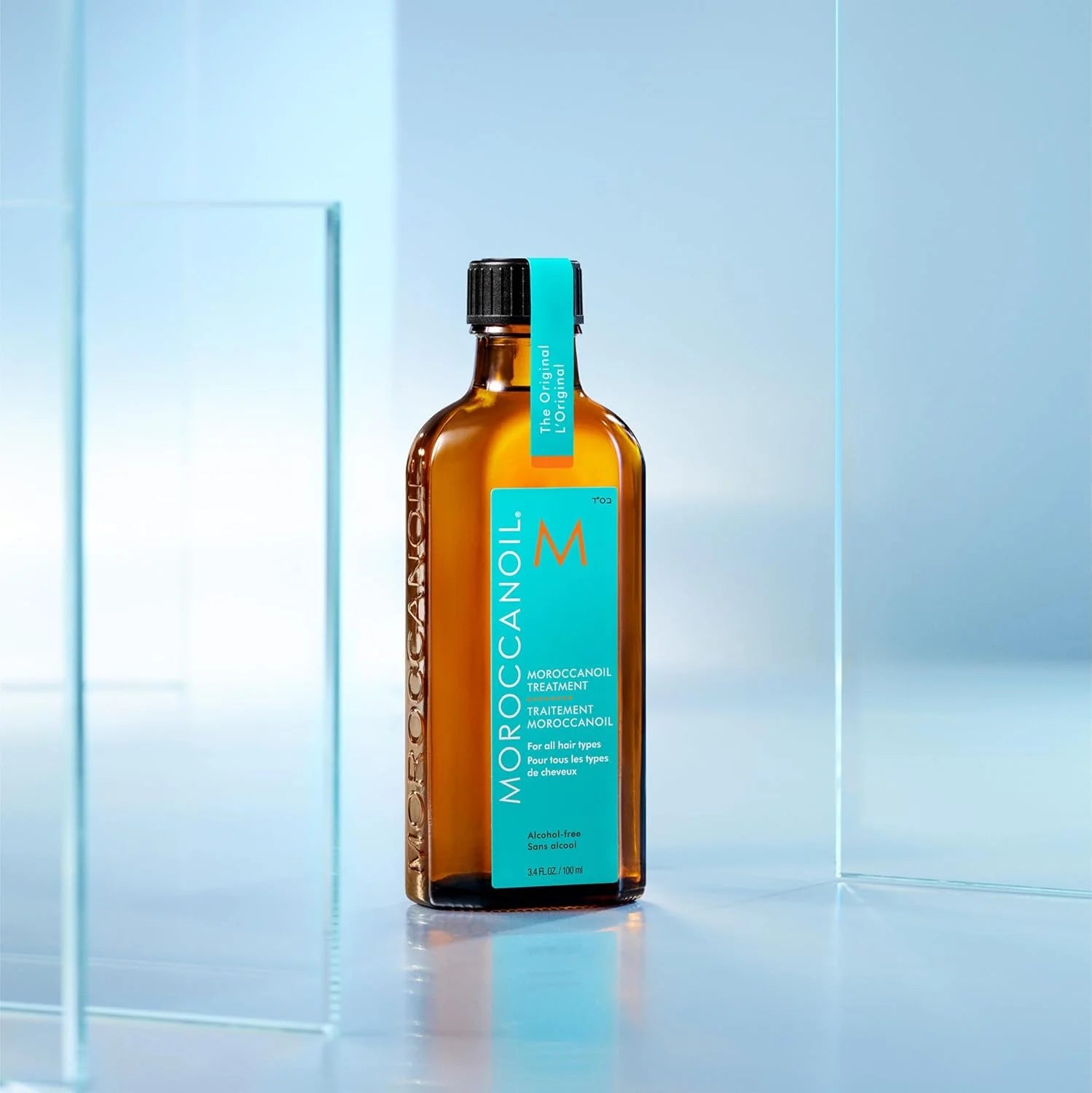 Moroccanoil Treatment Oil 100ml bottle on a sleek background, perfect for nourishing all hair types.