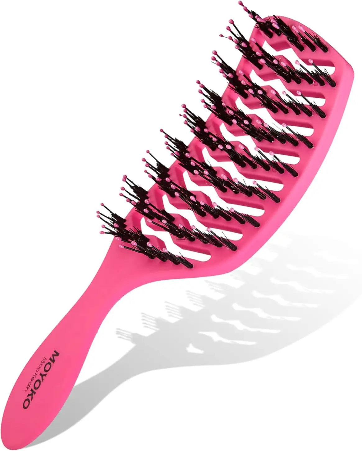 Pink hairbrush with black and white bristles arranged in a wavy pattern.