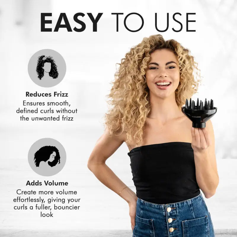 Hair styling tool resembling a claw-shaped brush held by a woman with curly blonde hair.