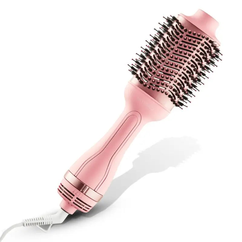 Pink electric hair styling brush with a round barrel and metallic bristles.