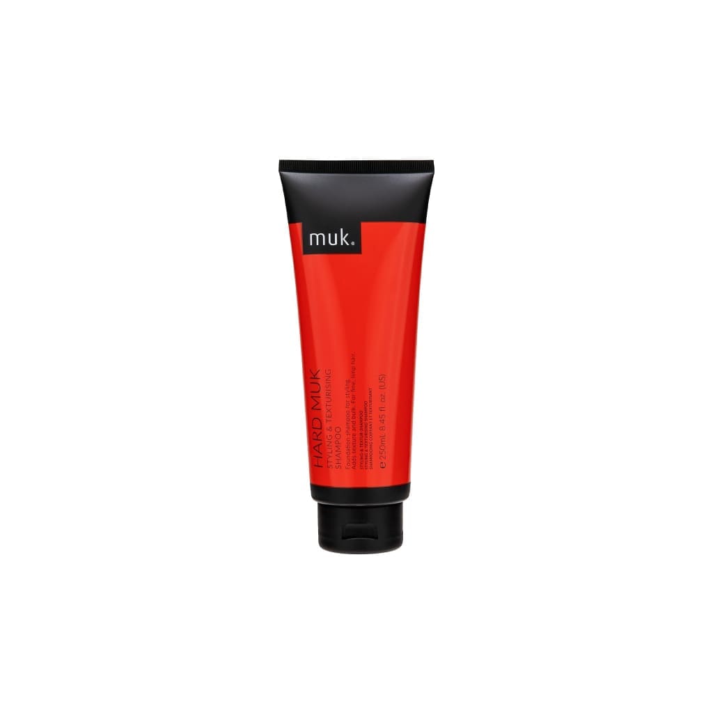 Red tube of muk hard muk styling & texturising shampoo - 250ml with black cap and label