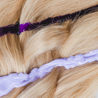 Blonde hair with purple toner & treatment. Neutralizing yellow tones. Violet hair dye for cool shades.