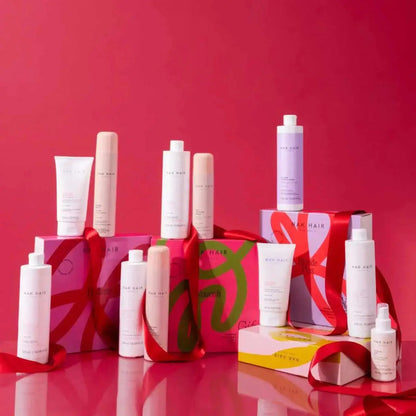 NAK Hair Holiday Gift Set: Nourishing Hair Care Products. Gifts for hair. Shampoo, conditioner, treatment, leave-in. Shop NAK Hair sets.