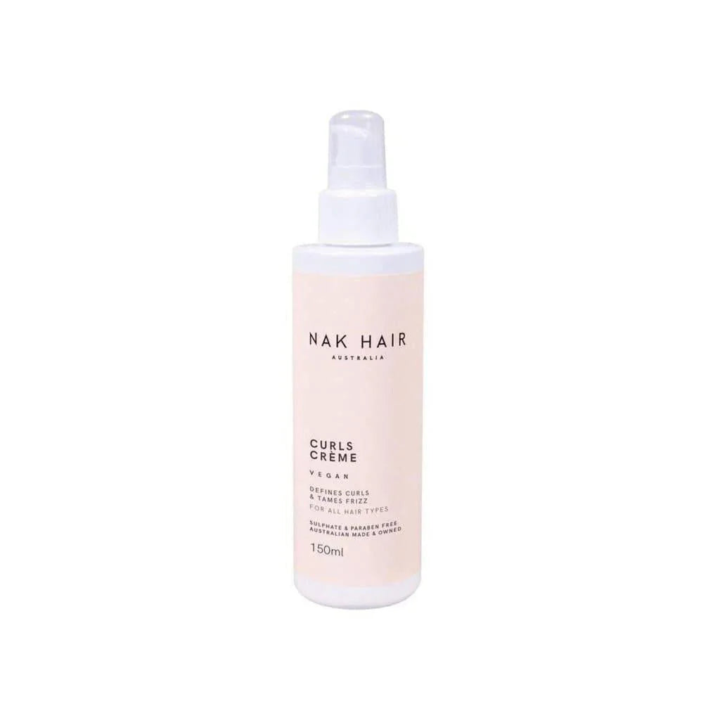 Pale pink bottle of Nak Signatures Curls Creme 150ml with spray nozzle for enhancing curl pattern