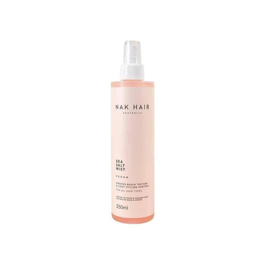 Pink bottle of Nak Signatures Sea Salt Mist 250ml for creating beach-textured hair