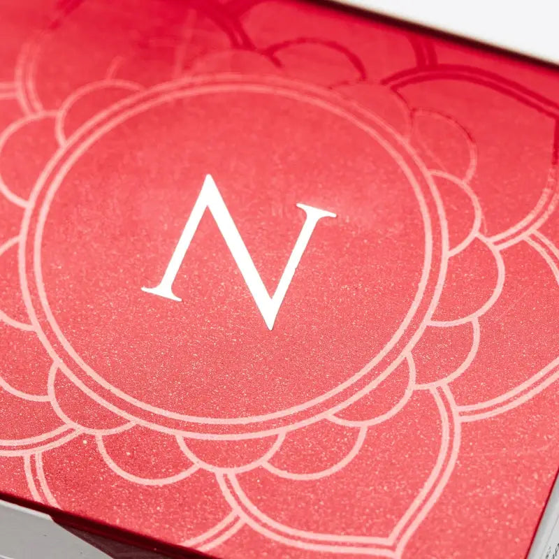 Red card or invitation with floral ’N’ design promoting Newtrino Hair Loss Capsules for Women