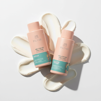 Inoar curl care shampoo and conditioner bundle with pink bottles on white cream background