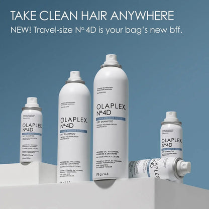 White bottles of Olaplex No.4D dry shampoo arranged in a product display.