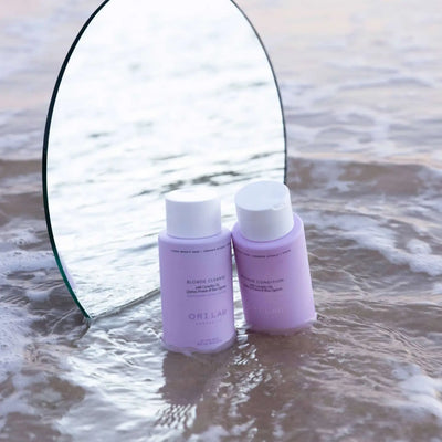 ORI Lab Blonde Shampoo & Conditioner Set: Hydrating hair care for blonde, highlighted, & color-treated hair on a beach background.