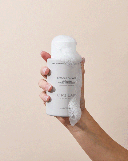 ORI Lab Restore Cleanse shampoo in hand with foam. Clean Beauty. Australian made.