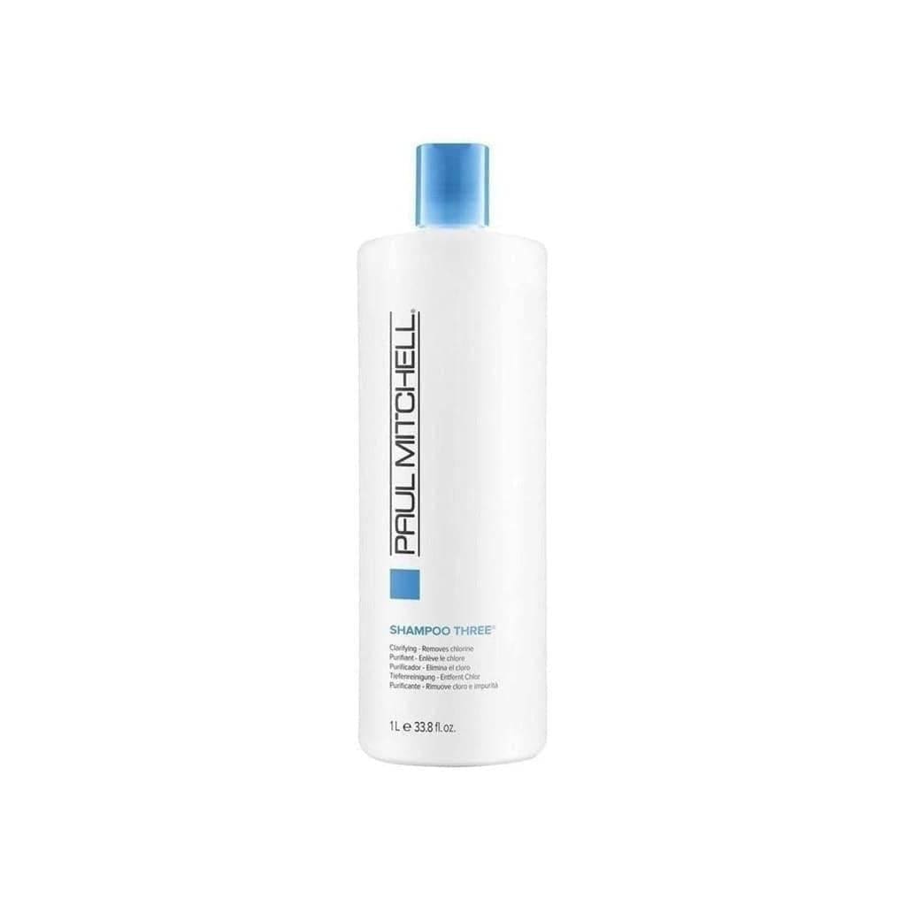 Paul Mitchell Shampoo Three 1L white bottle with blue cap, featuring triple-action technology