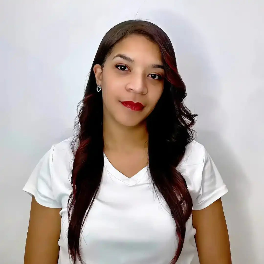 A person wearing a white v-neck t-shirt and red lipstick.