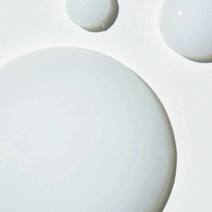 Close-up of Pureology Colour Fanatic treatment showcasing its creamy texture on a white surface