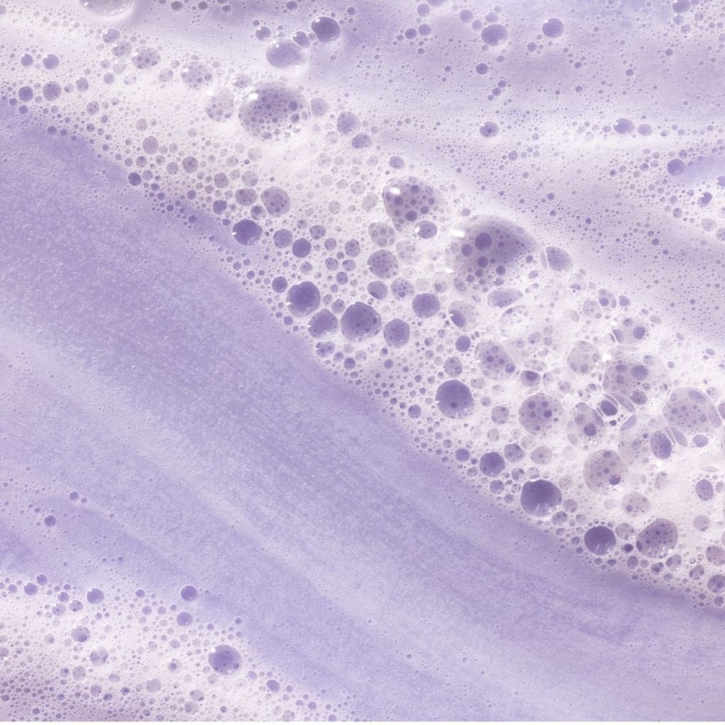 Frothy lavender bubbles from Pureology Hydrate Shampoo for color-treated hair