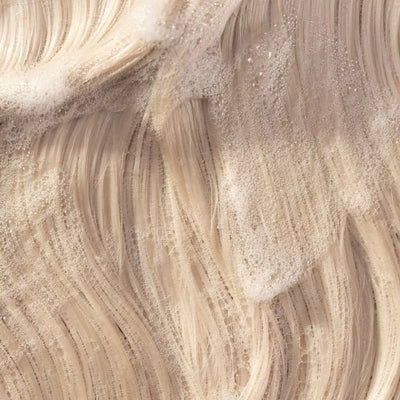 Voluminous blonde hair with Pureology Volume Shampoo lather. Boost hair volume with Pureology!