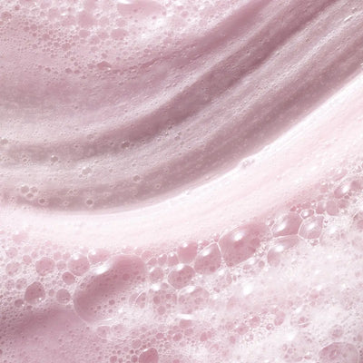 Pureology Volume Shampoo: Pink foam texture for volume boost and cleansing.