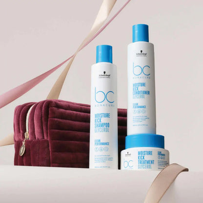 Hair care product line featuring shampoo, conditioner, and treatment in white and blue packaging.