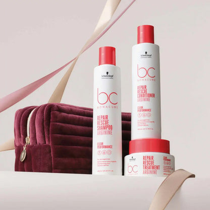 Hair care product line featuring shampoo, conditioner, and treatment cream with red and white packaging.